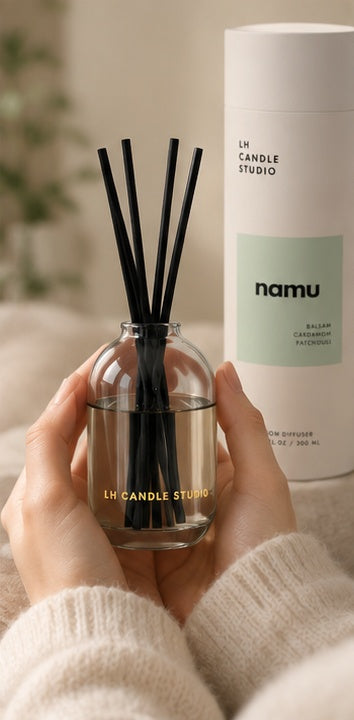 Hand holding the Namu reed diffuser by LH Candle Studio