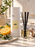 Yuja reed diffuser by LH Candle Studio on a bright, sunlit kitchen counter