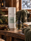 Namu reed diffuser by LH Candle Studio in a cozy wooden reading nook