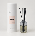Lorea reed diffuser by LH Candle Studio in a minimalist still life on a pale background