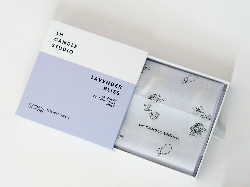 Lavender Bliss wax tablet box opened, wrapped in LH Candle Studio tissue paper